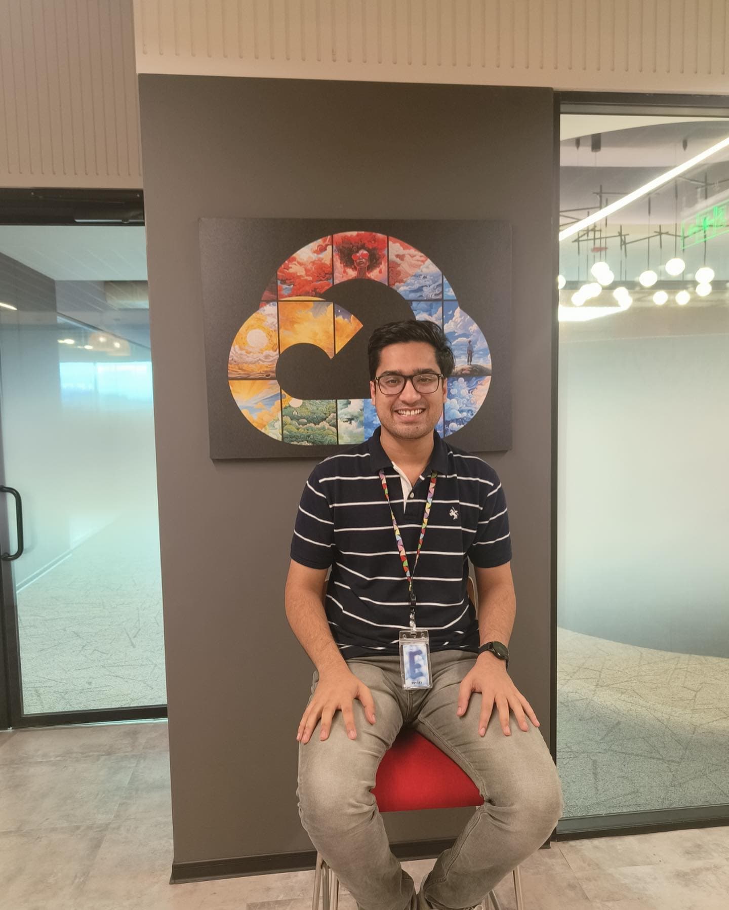 Aditya in front of the Google Cloud logo at the Google office